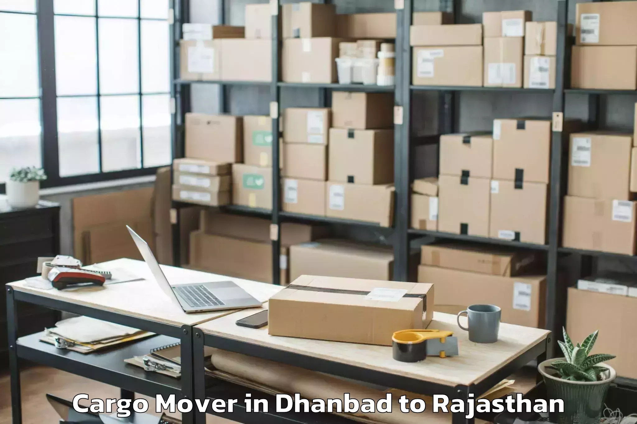 Top Dhanbad to Kherwara Cargo Mover Available